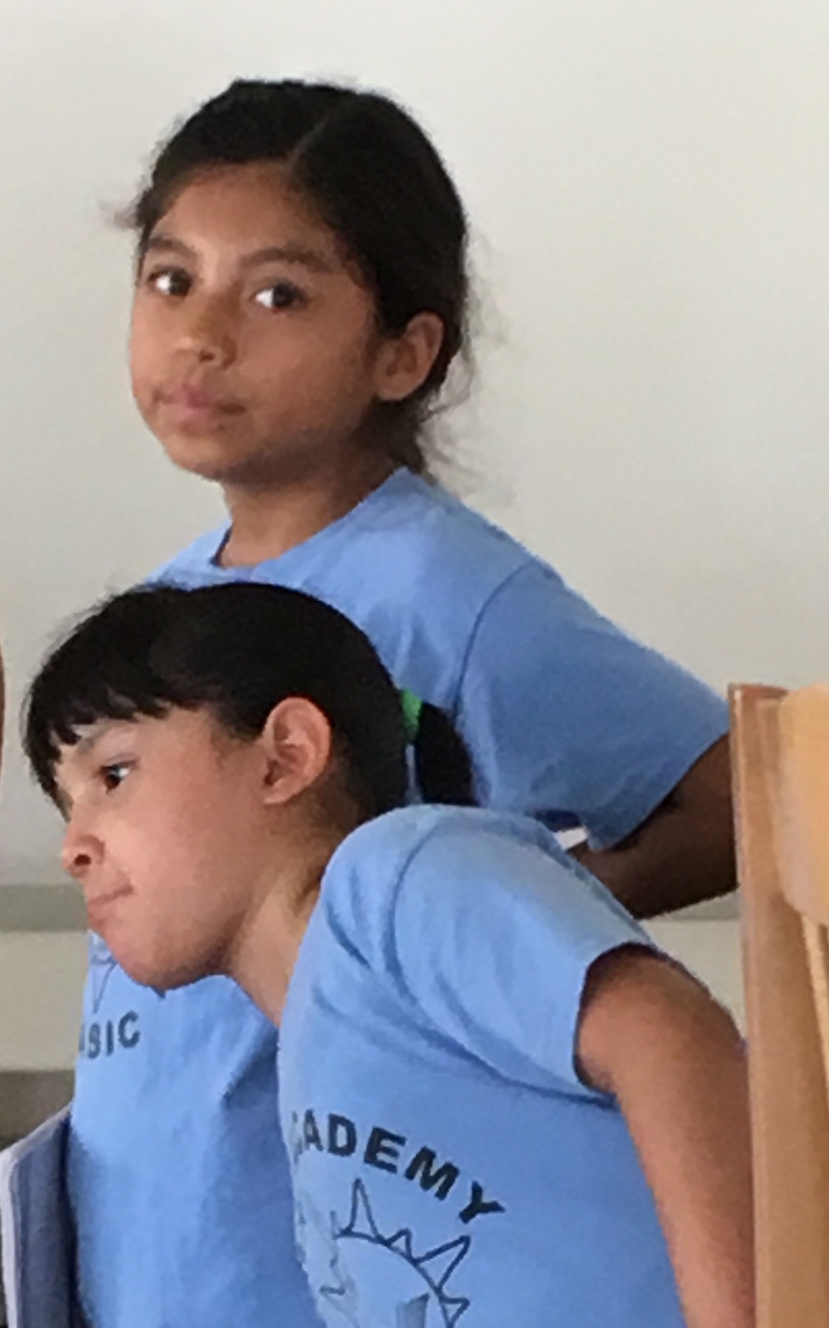Two Reading Academy students in matching program t-shirts