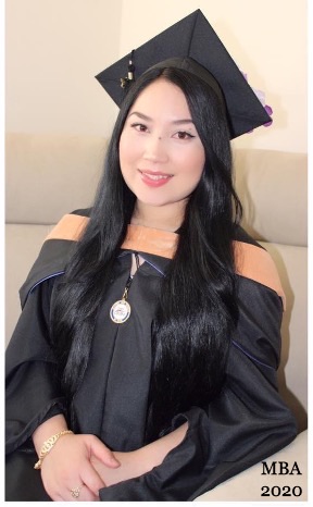 Clara Arias in cap and gown at her California State University San Marcos graduation