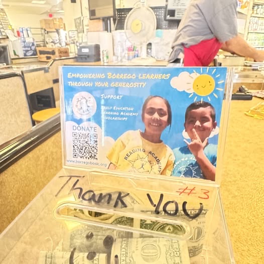 The BASIC donation box at The Pantry Market with a handwritten Thank You note taped to the front