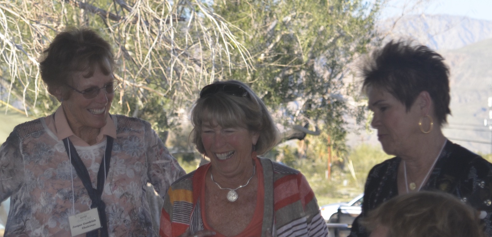 Three women talking and laughing together at Circle of Art